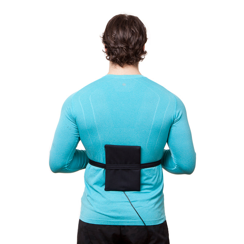 Patient with DCcure portable pemf device pad on back
